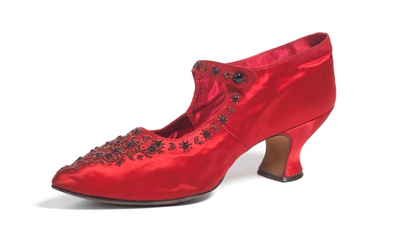 Red satin shoe from the Shoephoria exhibition at Fashion Museum Bath